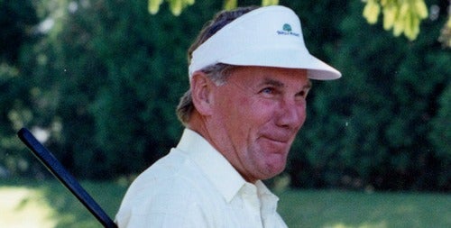 Burt Matthews playing golf.
