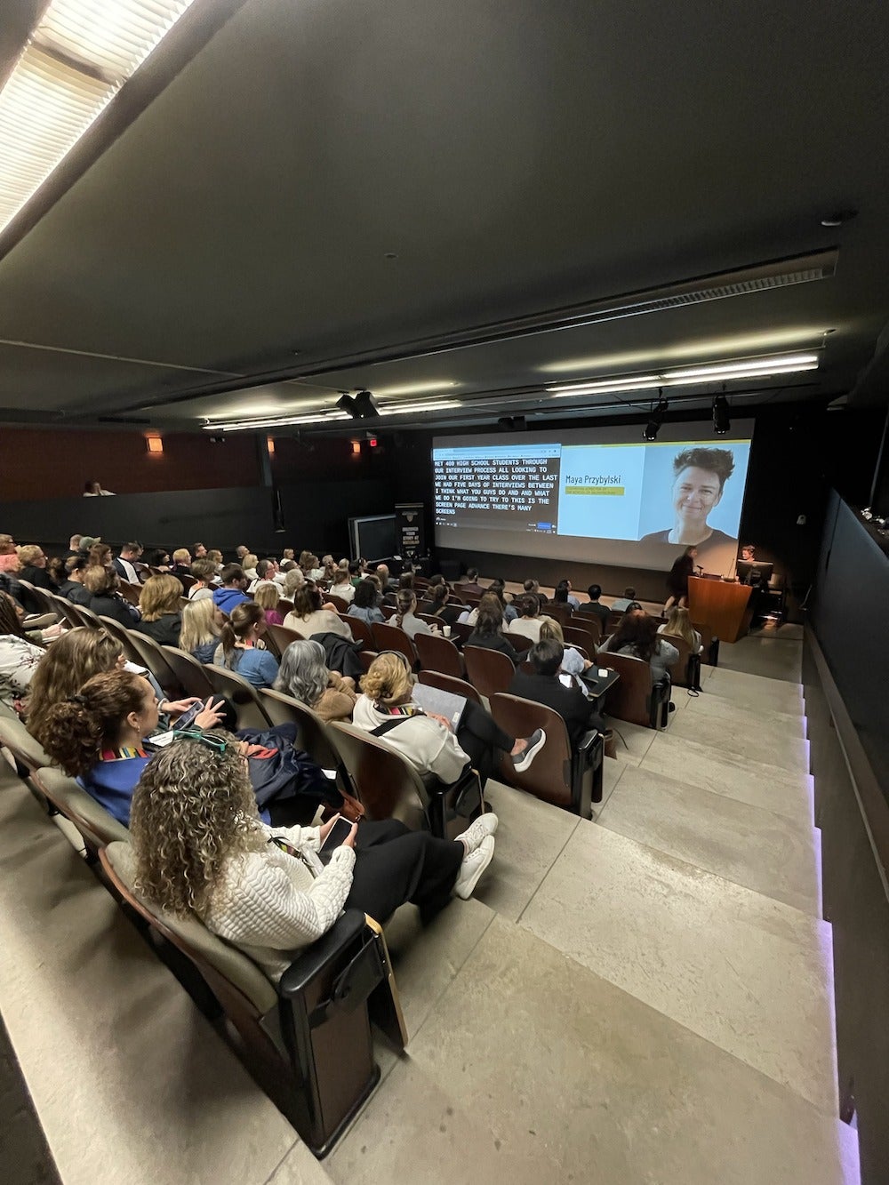 Guidance Counsellors in a lecture hall watching a presentation.