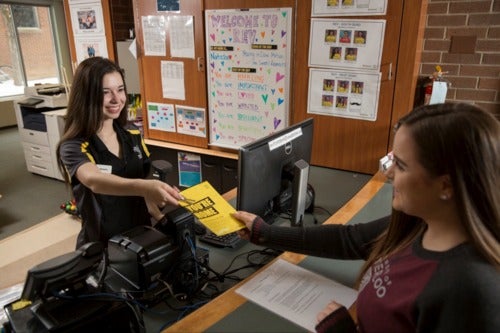 A student receives housing information from a Waterloo Residences representative.