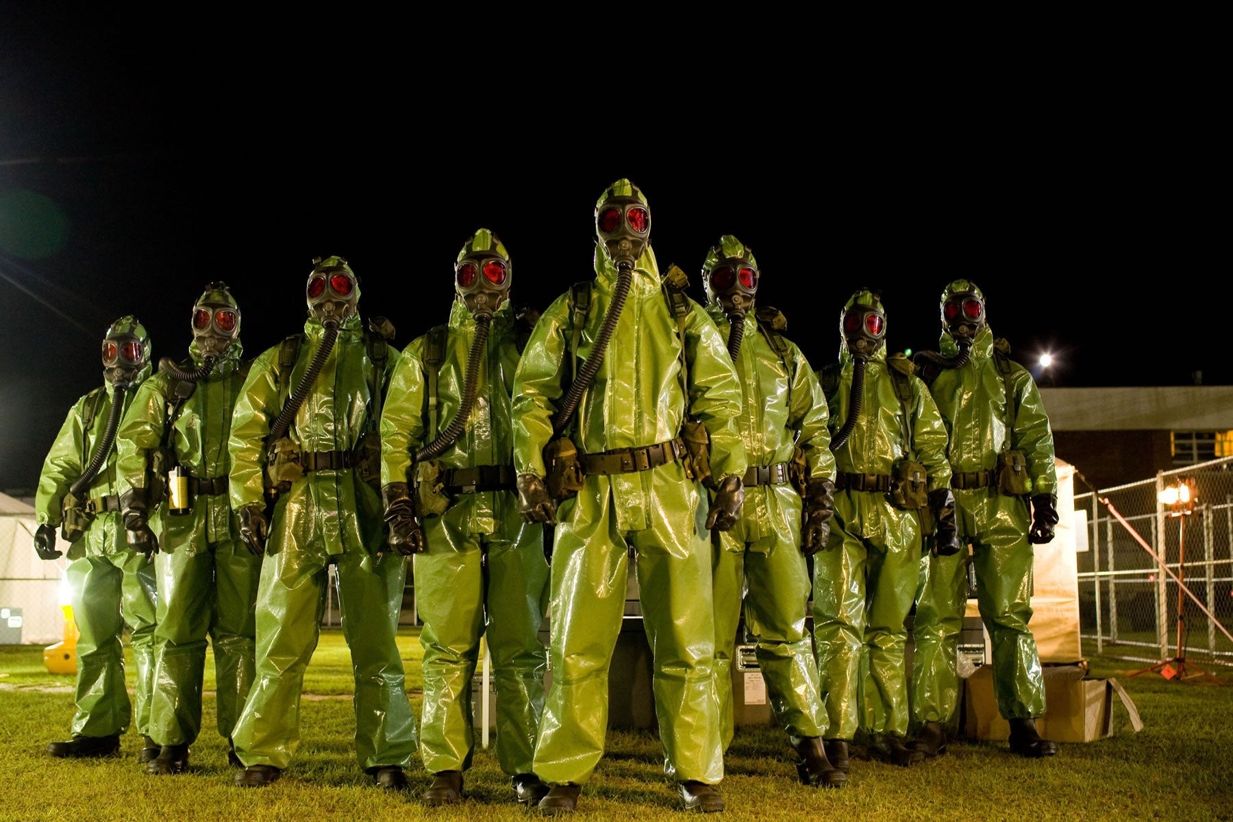 a phalanx of Hazmat suit-wearning first responders.
