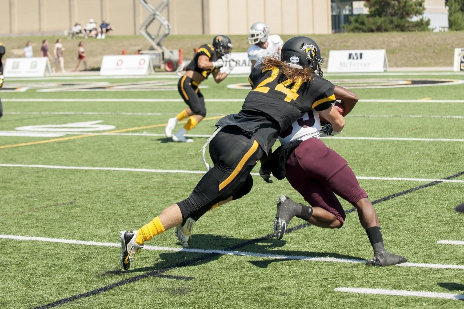 Jordan Hoover playing football.