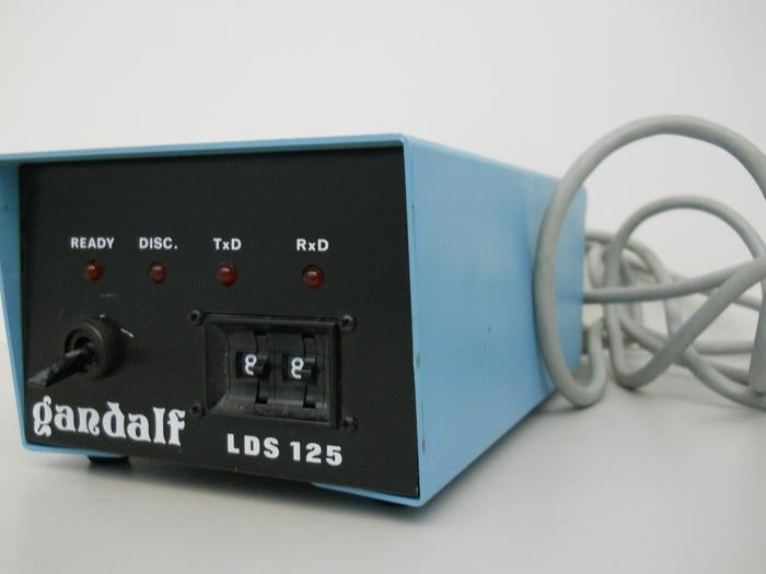 A blue Gandalf modem with power cord.