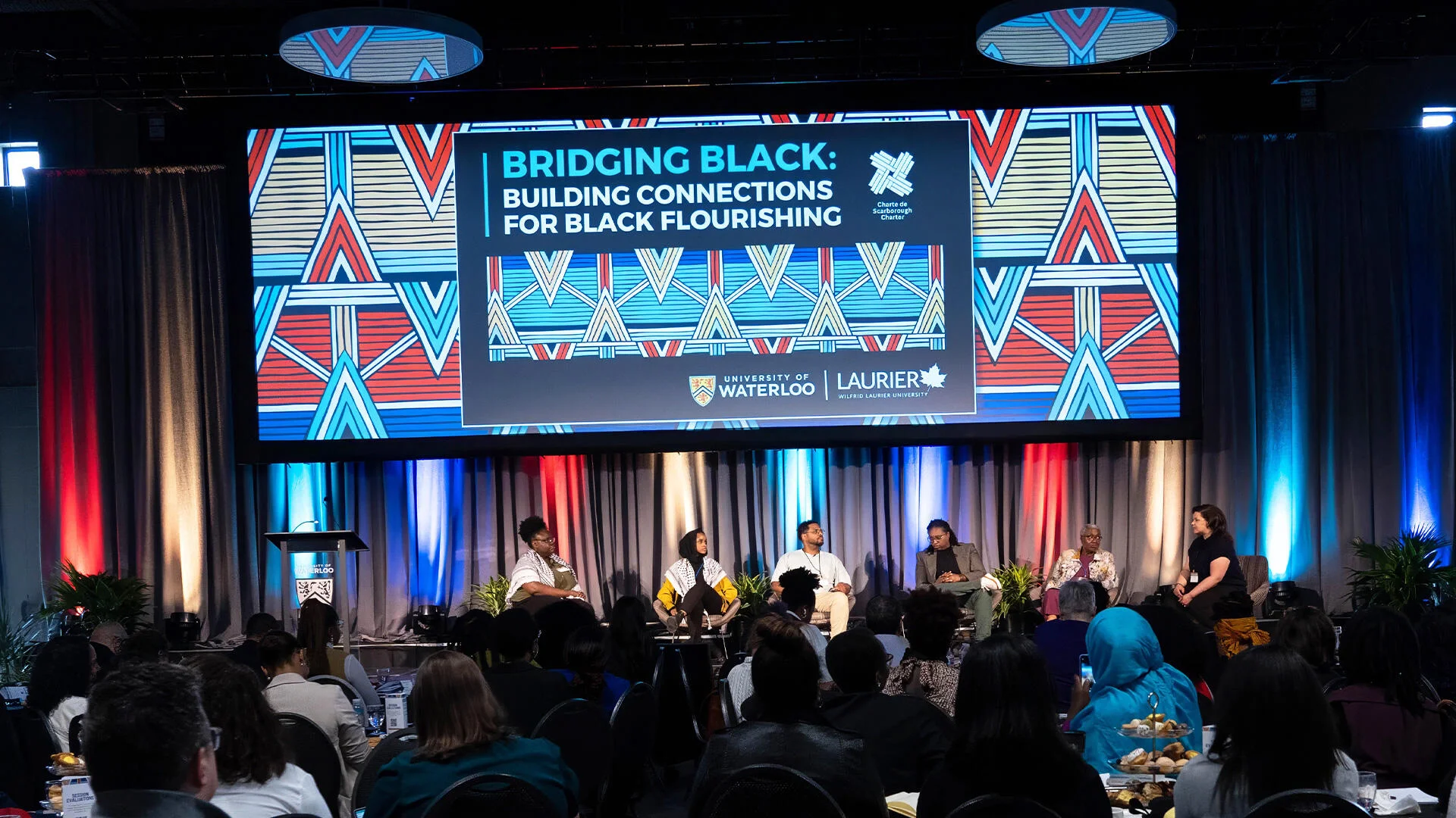 Panel participants on stage at the Scarborough Charter event.