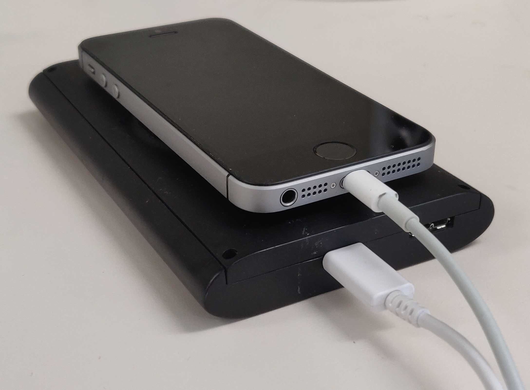 A radar box shown beneath a smartphone to show its small size.