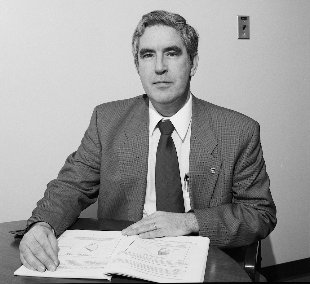 Bob Truman sits at a table in a 1994 photo