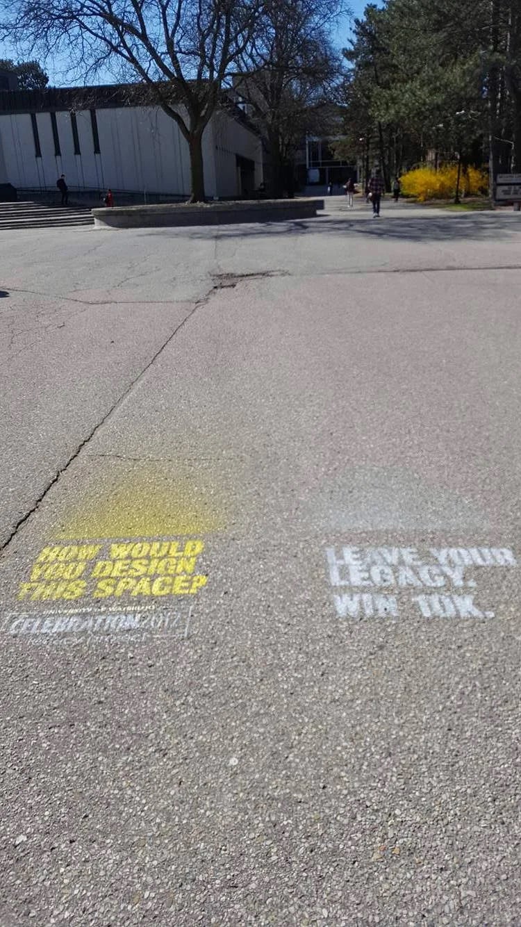 Stenciled slogans advertise the Celebration 2017 initiative in the Arts quad.