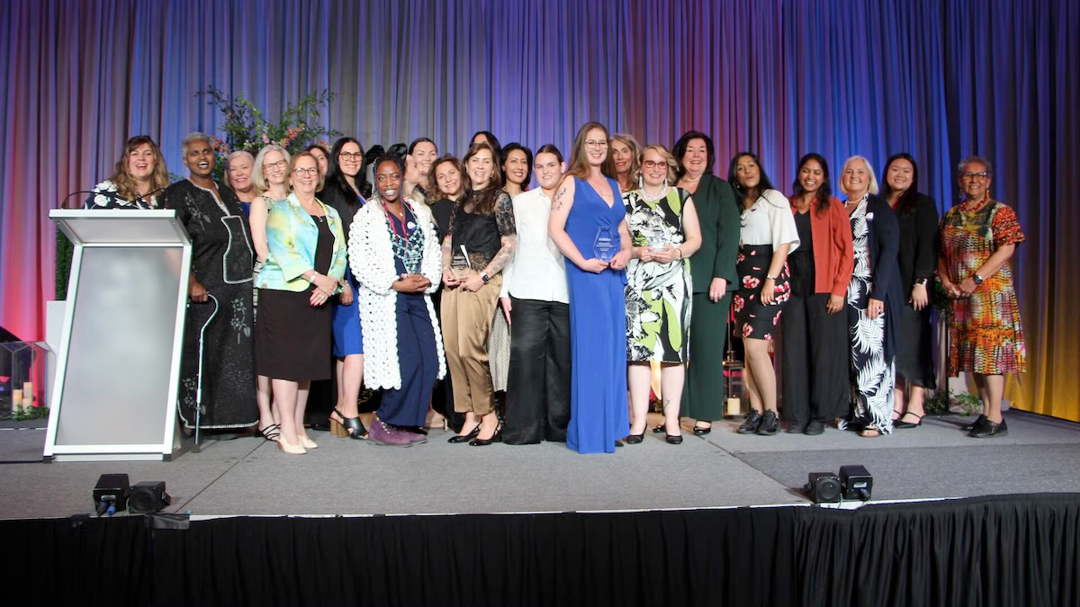 Oktoberfest Women of the Year recipients on stage.