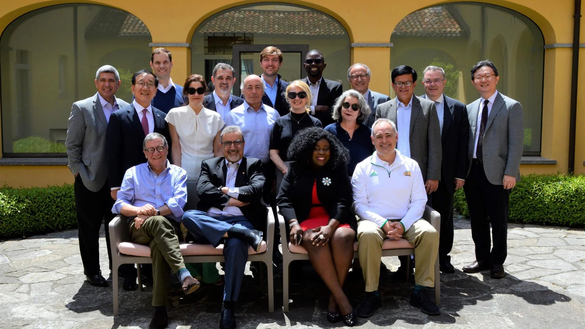 President Feridun Hamdullahpur and participants in a symposium in Italy.