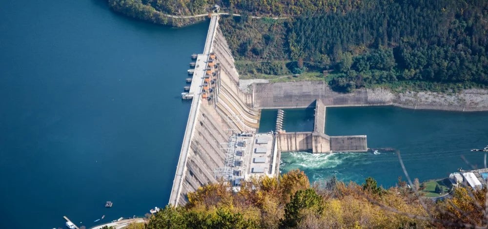 An aerial view of a dam and reservoir.