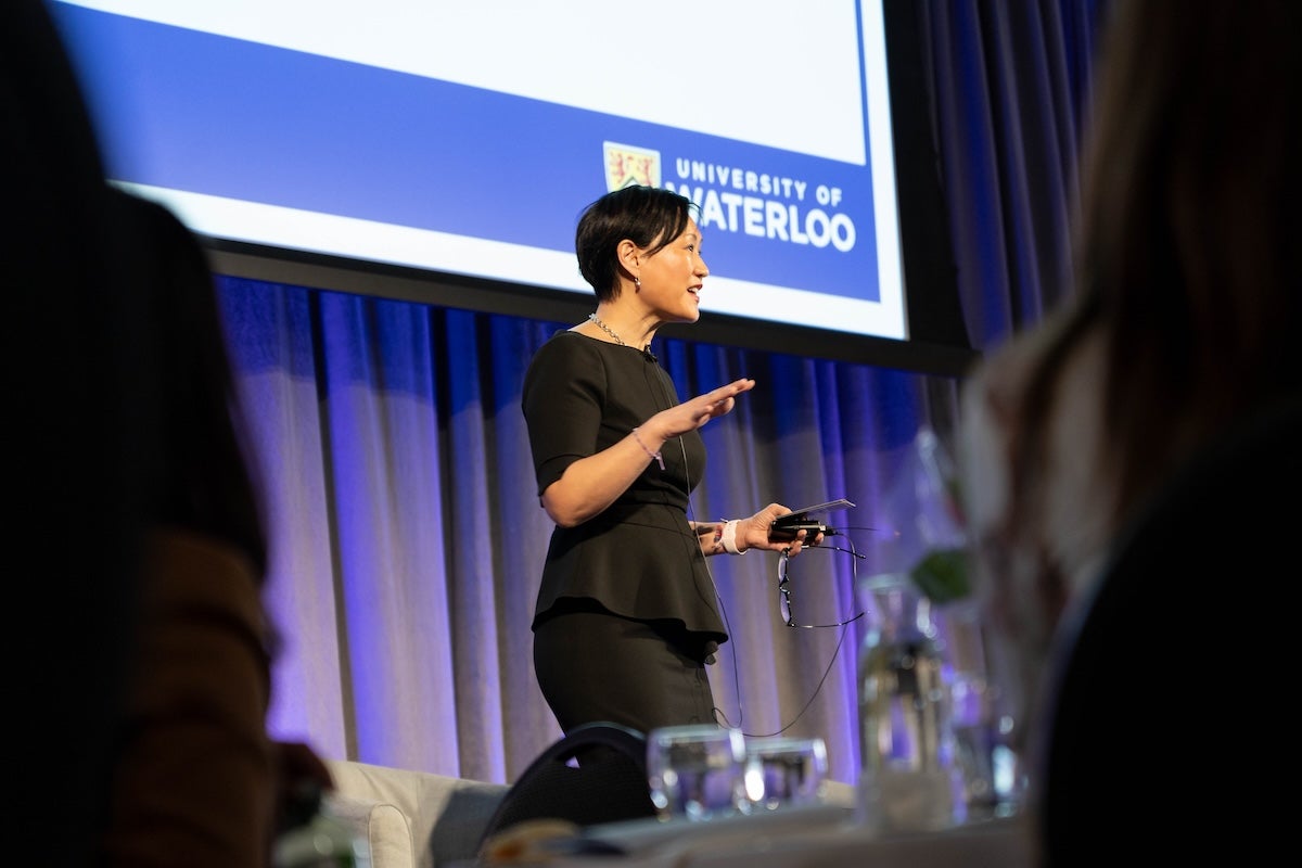 Jennifer Lee delivers a presentation at an International Women's Day event.
