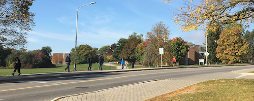 Students walk towards Village 1.