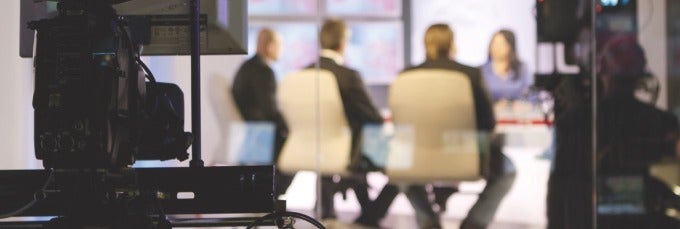 An image of a media interview taking place.