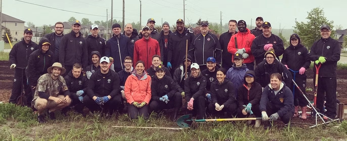 Athletics volunteers at a public garden.