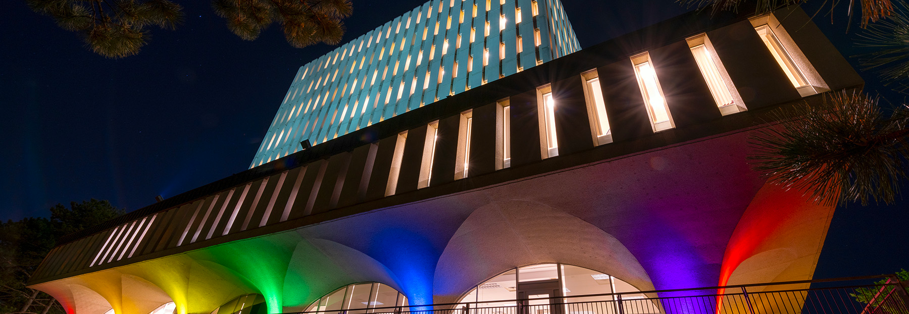 The Dana Porter library lit up with rainbow colours.