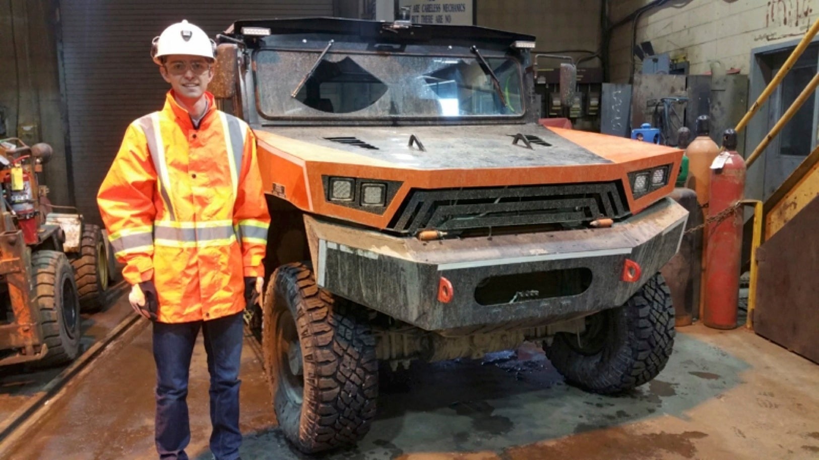 Matthew Gougeon stands next to the MineMaster Commander vehicle.