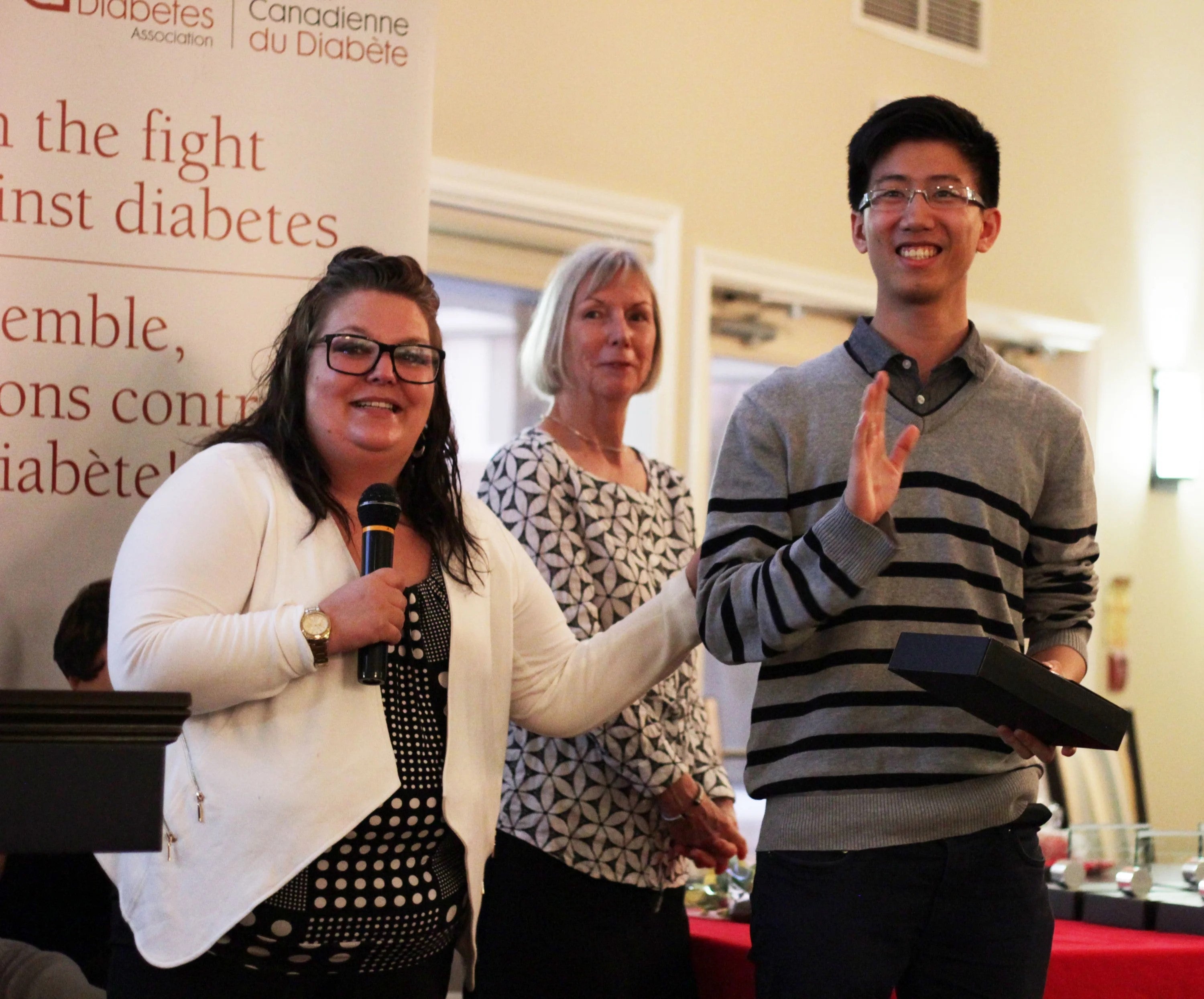 Abraham Lin receives his award.