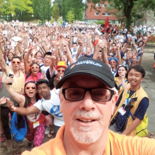 Dean of Arts Doug Peers takes a selfie with Arts undergraduates at Orientation.