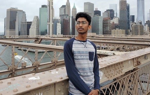 Kerthanan Srikantharajah stands on a bridge.