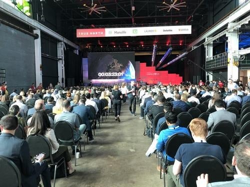 A large crowd of people in an event venue