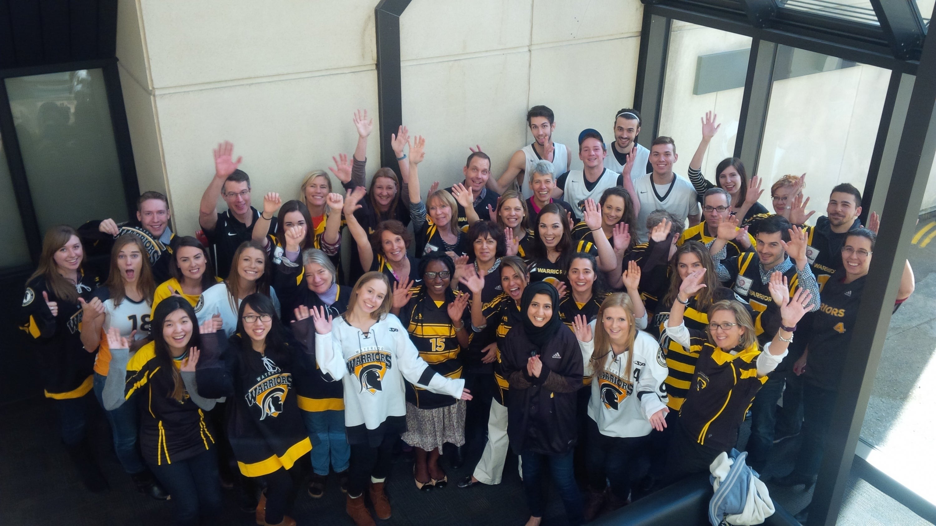 Campaign Waterloo volunteers in Warriors jerseys.