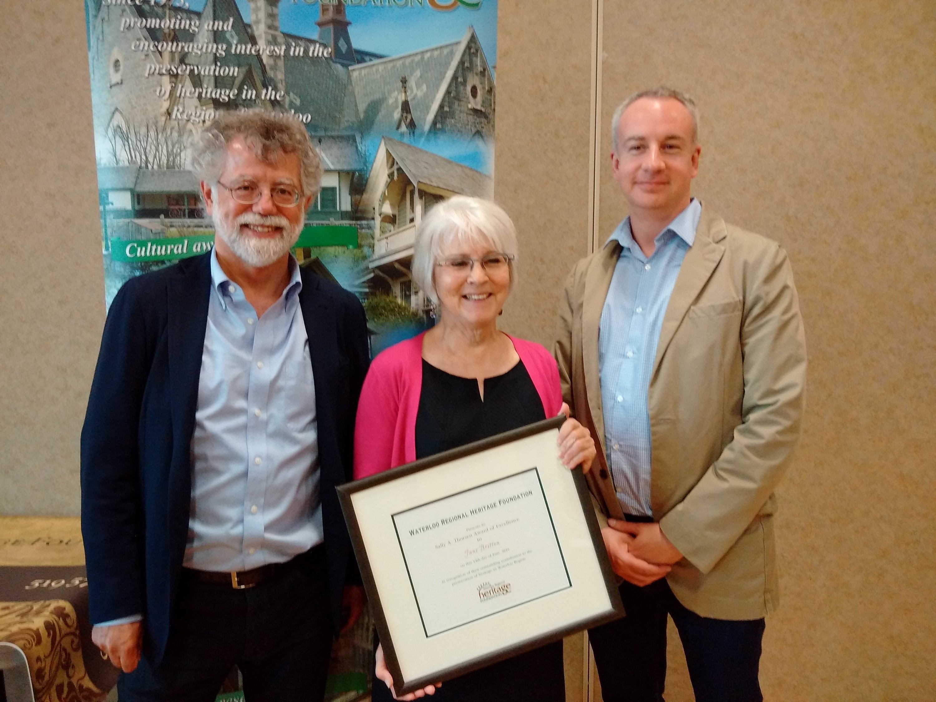 Jane Britton is pictured with former University Librarian Mark Haslett and current Head of Special Collections and Archives Nick Richbell.