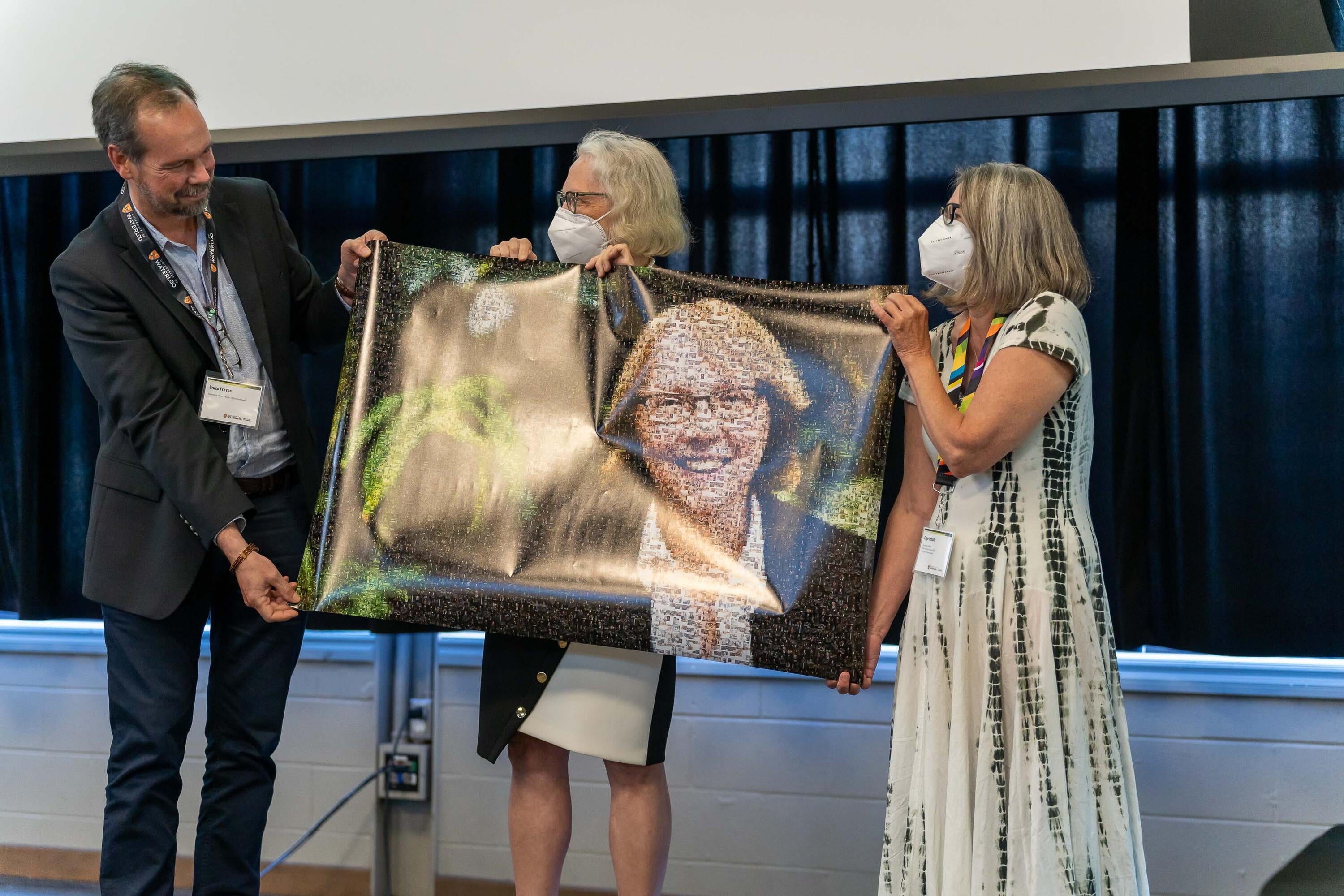 Jean Andrey holds up a poster with her face on it.