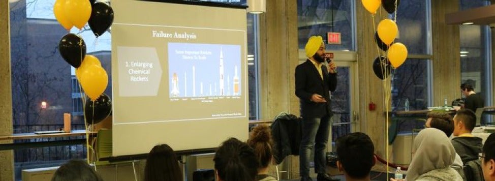 A man delivers a pitch during the Problem Lab competition.