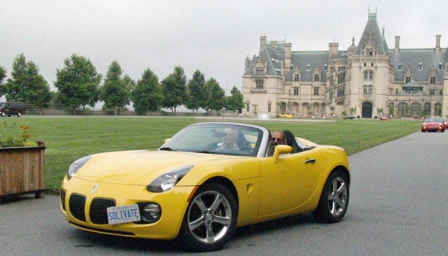 Allan Fleming behind the wheel of his Pontiac Solstice convertible.