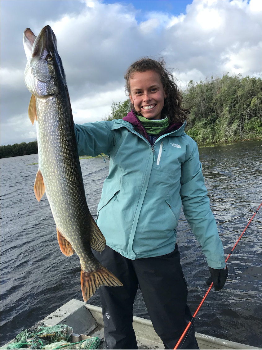 Laura Neary holding a fish.