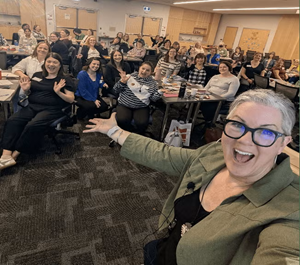 Jan Vilaca takes a selfie with Community of Practice attendees