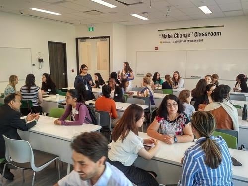 Participants in a speed mentoring event at tables.