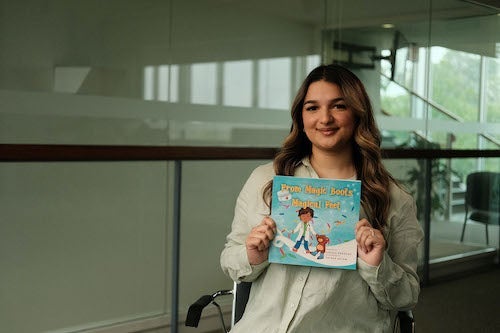 Unzila Shahzad poses with her book.