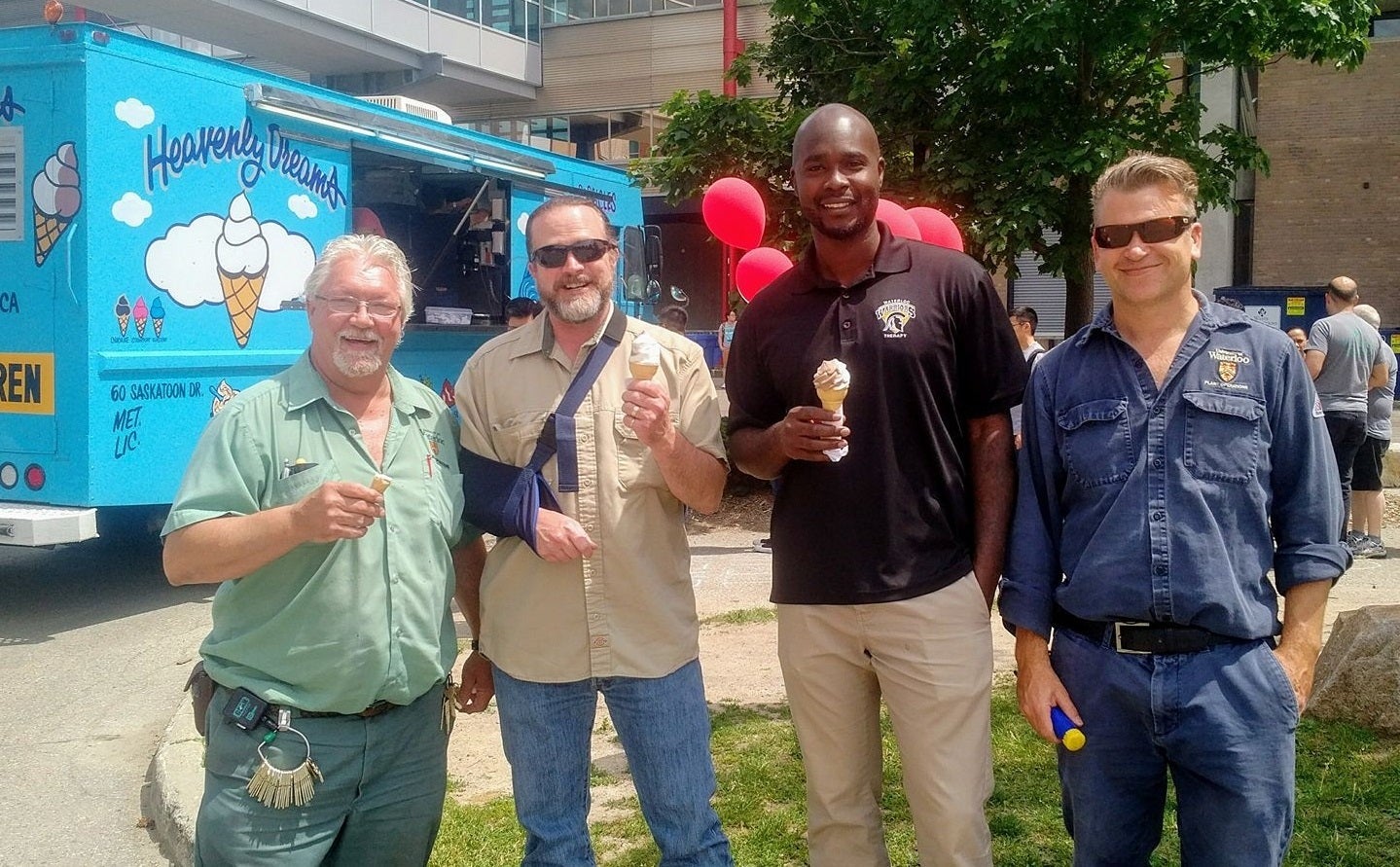 Waterloo staff members enjoying ice cream cones.