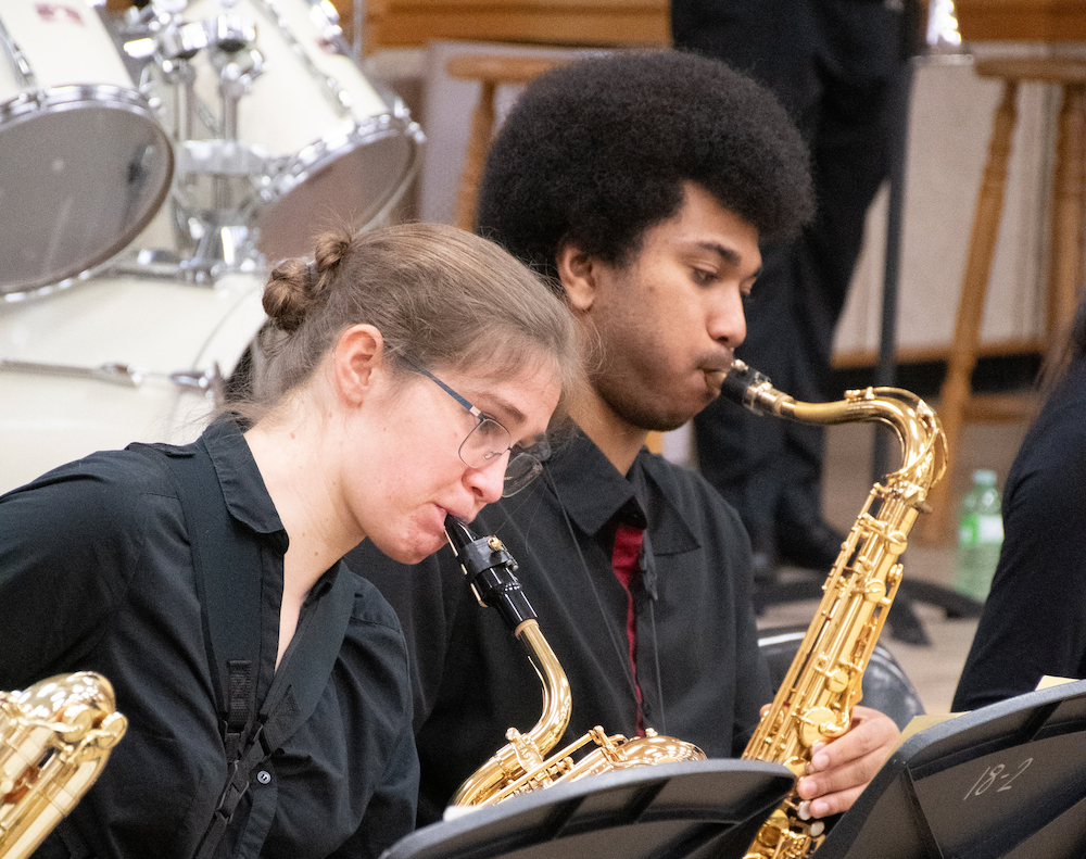 Two saxophone players in the jazz ensemble.