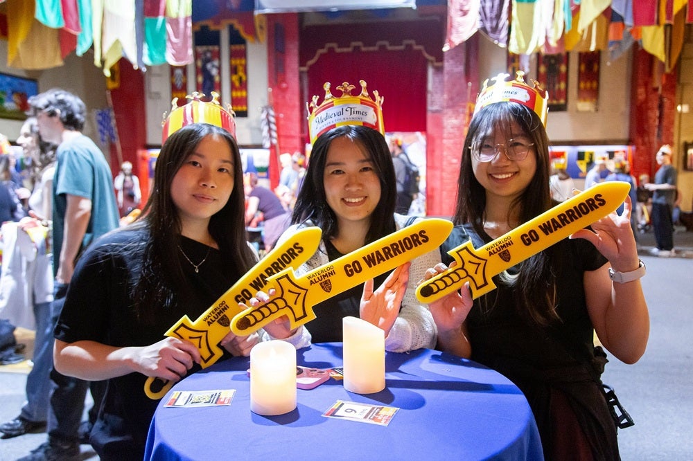 Alumni show their school spirit with Warriors swords 