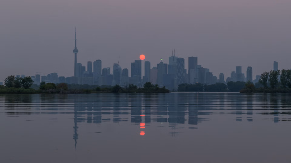 Wildfire smoke against the Toronto skyline.