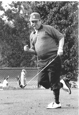 Patrick Mihm celebrates on the golf course.