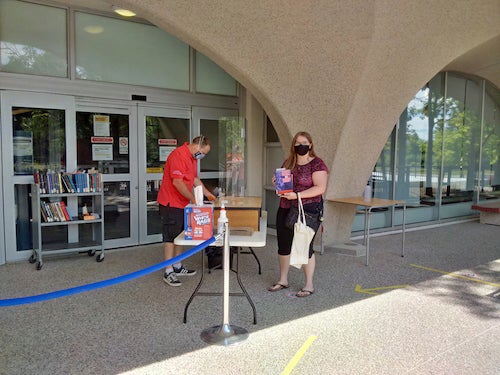 Sam Schott in the service line at the Library curbside pickup.