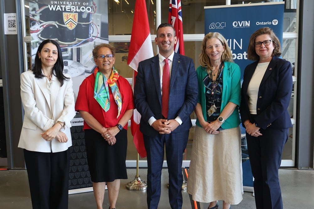 Charmaine Dean and Mary Wells gather with OVIN executives.