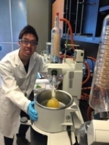 A scientist next to some scientific equipment.