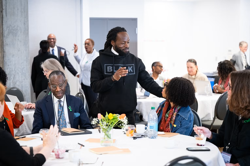 Dr. Christopher Taylor (middle), Associate Vice-President of EDI-R, speaking to a guest at the 2026 Inter-Institutional Forum of the Scarborough Charter. Photo credit: The Scarborough Charter.