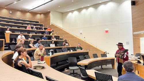 Elder Myeengun Henry leading the opening ceremony at the University of Waterloo's first BioBlitz.