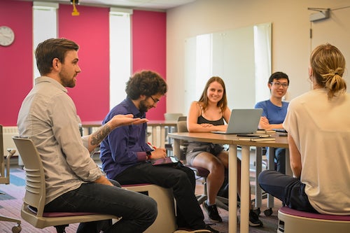 Students in a meeting.
