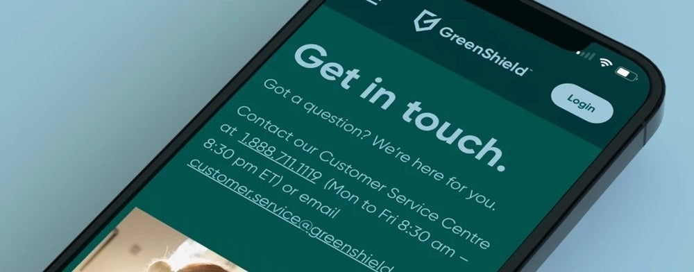 A close-up shot of a smartphone displaying the GreenShield app's customer service information.