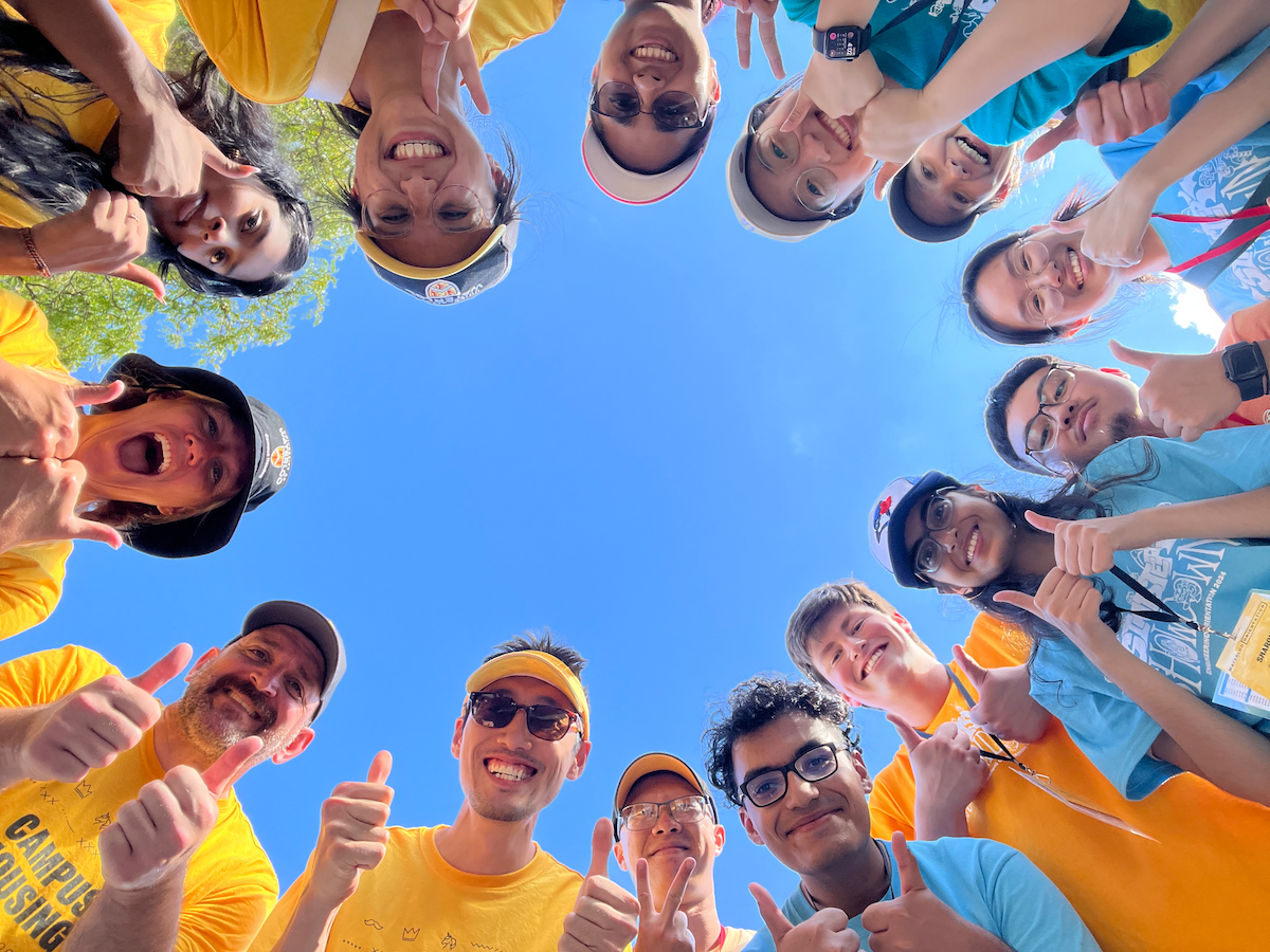 Move-In volunteers giving the thumbs-up sign.