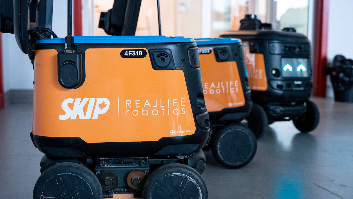 A row of three Skip delivery robots.