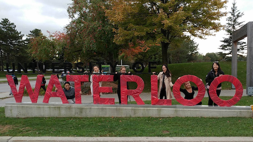 The University of Waterloo sign wrapped in red for the United Way campaign.