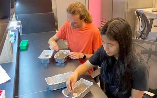 Hayden Epp and Mia Hepburn analyzing soil samples.