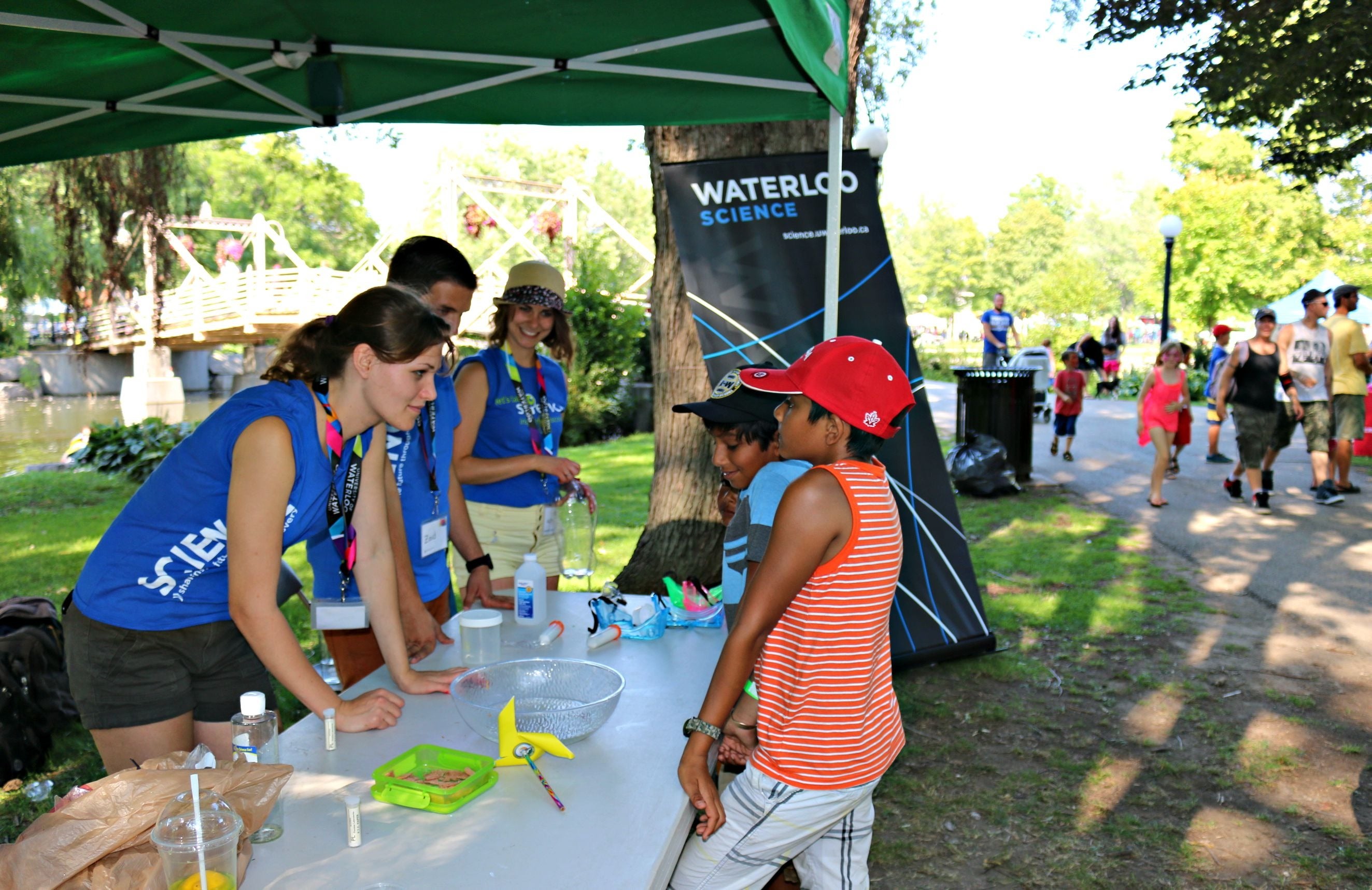 Volunteers and kids at the Science booth.