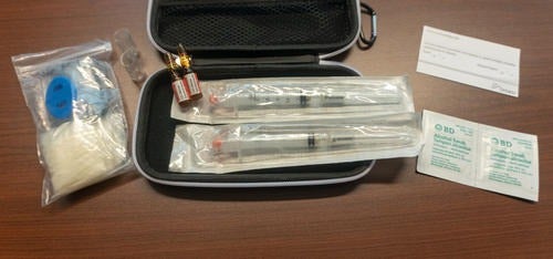 An open naloxone kit.
